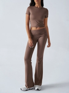 Detail of high-waisted flare trousers with fold-over waistband in brown lounge set