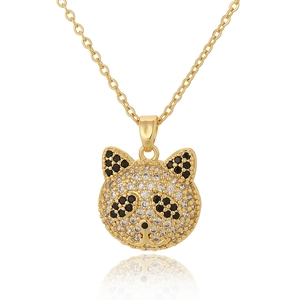 Gold panda pendant necklace with black and white zircon pave setting on white background