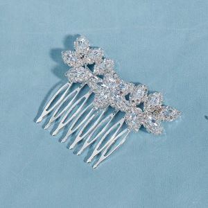 Close-up of sparkling marquise and round zircon floral patterns on a silver bridal hair comb