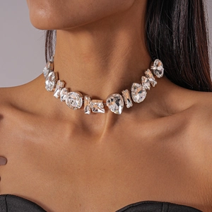 Close-up of sparkling clear geometric crystal necklace on a model's neck