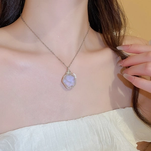 On-model view of silver wire wrapped lavender crystal pendant necklace on fine chain