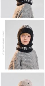 Detail of children's knit balaclava showing black and white jacquard pattern and soft texture