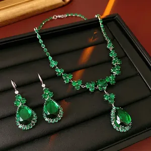 French vintage silver necklace and earring set with pear-cut green zircon drops