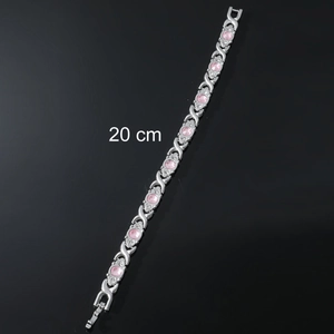 Silver chain bracelet with pink gemstones and clear crystals, 20 cm length on black background