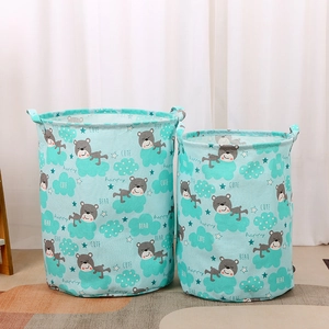 Large mint green laundry basket with cute bear prints and handles for home storage