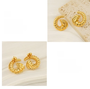 Detail of 18k gold plated spiral titanium steel earrings with anti-allergy studs