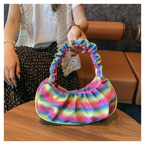 Detail of rainbow pleated shoulder bag showing colorful gradient nylon and ruched texture