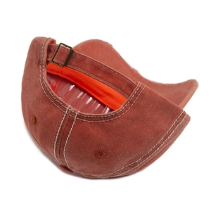 Vintage brick red washed cotton baseball cap with adjustable metal buckle and orange lining