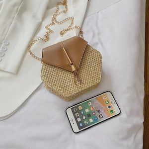 Hexagonal woven crossbody bag with brown faux leather flap and gold tassel chain strap