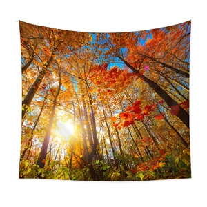 Detail view of autumn forest tapestry showing vibrant orange leaves and soft sun rays