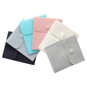 Set of six colorful velvet jewelry pouches with snap buttons for ring and necklace storage