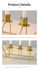 Detail of gold metal sleigh candle holder with anti-rust finish and sturdy base