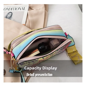 Detail shot of the spacious interior with a double zipper and stylish graffiti patterns
