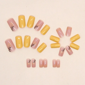 Mid-length square ginger yellow press-on nails with floral patterns and glossy finish