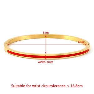 Detail showing 3mm width and 5cm x 6cm inner diameter of the golden enamel bangle