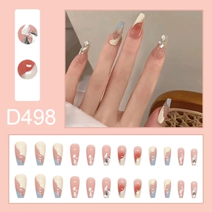 Sparkling galaxy glitter press-on nails in long coffin shape with nude pink and blue design