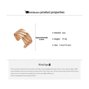 Detail of golden wave texture cuff bracelet with 5.6cm diameter and iron material specs