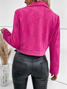 Back view of a vibrant rose pink suede jacket paired with slim fit black leather pants