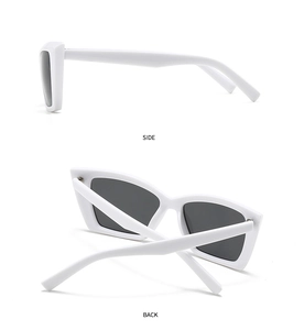 Detail view of bold white square frame sunglasses showing side and back structural design
