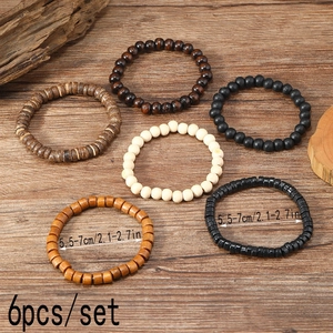 Detail showing 6pcs/set of handmade wooden beaded bracelets on a rustic wood background