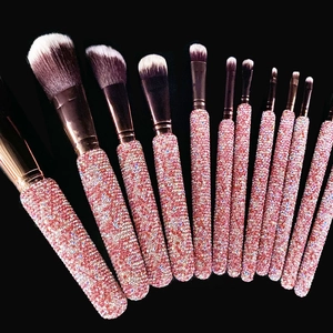 11-piece premium makeup brush set with sparkling pink rhinestone handles and bicolor bristles