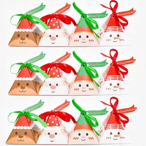 Detail of colorful pyramid Christmas gift boxes with Santa and Reindeer designs