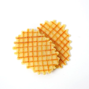 Artificial waffle cookies with caramel grid texture for bakery window display and prop