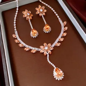 Set collana e orecchini vintage con zirconi a goccia e pietre color champagne dorate