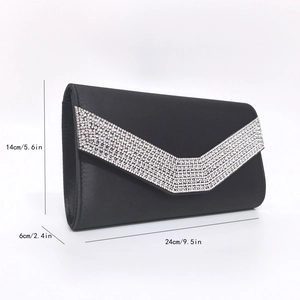 Detail view of black clutch bag with V-shaped rhinestones and size dimensions in inches
