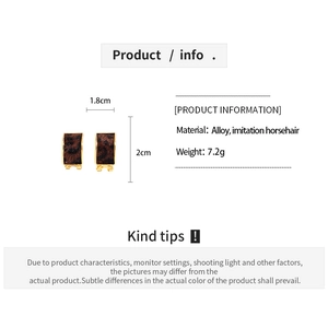 Detail view of leopard print faux horsehair C-shaped earrings with alloy sizing data