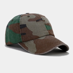 Detailed view of camouflage baseball cap with classic green forest pattern and curved brim