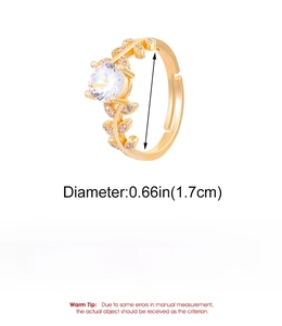 Detail view of gold leaf ring showing copper material specs and large round cubic zirconia