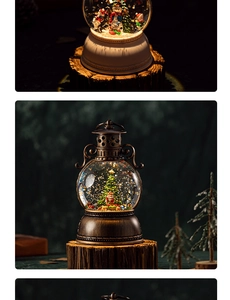 Close-up of vintage Christmas lantern snow globes with snowman and tree inside