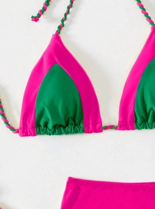Detail of color-block bikini top with woven straps in vibrant rose and green