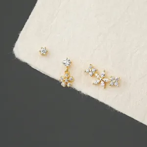 Three-piece S925 sterling silver flower earring set with gold plating and clear zircons