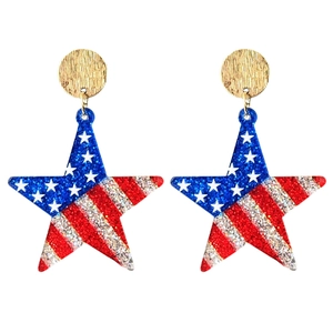 Macro detail of star earrings with American flag glitter patterns and gold studs