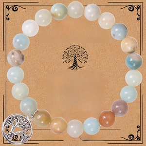Detail of beaded natural stone bracelet with silver tree of life charm on gift card