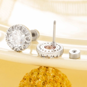 Silver steel stud earrings with large central zircon and screw back closure design