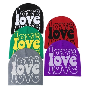 Winter knitted beanies with LOVE jacquard pattern and heart detail in five colors