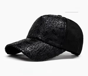 Detail of black baseball cap featuring geometric embossed texture and mesh panels