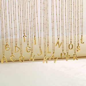 Polished gold 3D initial bubble letter necklaces on bead chains for women