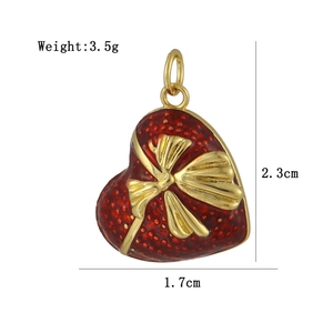 Detailed size view of red heart pendant with gold bow showing 2.3cm height and 3.5g weight