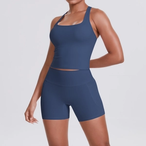 Detail of high-waisted navy blue workout shorts with functional side pockets