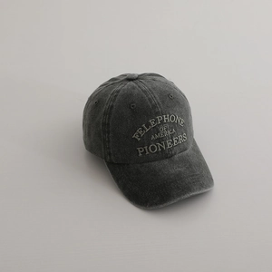Close-up of vintage charcoal grey washed cotton baseball cap with American pioneers embroidery