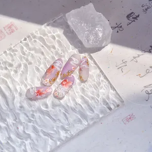 Detailed view of matte purple gradient press-on nails with koi fish and floral art