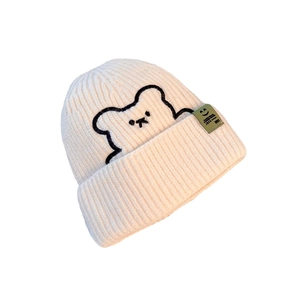 Winter beige knit beanie with cute bear embroidery and stylish side label for women