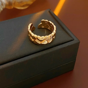 18k gold plated open heart ring with sparkling micro-pave crystals on a jewelry box