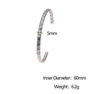 Detail view of silver stainless steel bangle showing 60mm diameter and 5mm width measurements