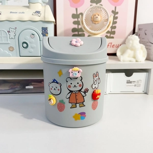 Cute gray mini desk trash can with cartoon stickers and press-top lid for office