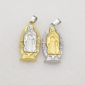 Golden and silver Guadalupe Virgin Mary pendants on a textured light background
